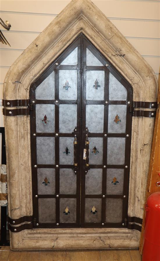 A Gothic style wrought iron framed window with heavy reconstituted stone frame H.160cm